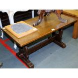 A REPRODUCTION OAK RECTANGULAR TOPPED REFECTORY DESIGN COFFEE TABLE, on twin shaped pierced plank