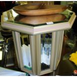 AN ART DECO DESIGN MIRRORED COFFEE TABLE having hexagonal bevelled top, on an insert bevelled