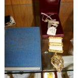 THREE PIECES OF MASONIC REGALIA to include an apron badge, a hallmarked silver set square necklace