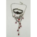 AN "ALCHEMY" PEWTER ROCOCO HEART BRACELET, set with red Swarovski crystal, no.89, together with a