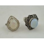 TWO DRESS RINGS, one moonstone set, the opal set (2)