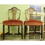 A PAIR OF 19TH CENTURY MAHOGANY SHEILD BACKED DINING CHAIRS WITH PIERCED CENTRAL SLAT having over-