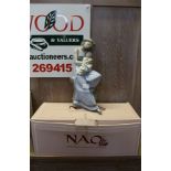 A LARGE NAO SPANISH PORCELAIN FIGURINE OF A MOTHER CRADLING HER CHILD sold with original box