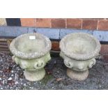 A PAIR OF SMALL SIZED CAST CONCRETE GARDEN PLANTERS