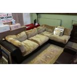 A LARGE MODERNIST MODULAR SOFA of four sections, the chocolate brown leatherette covers and old gold