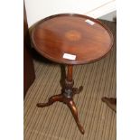 A WELL MADE REPRODUCTION SAUCER TOPPED WINE TABLE with inlaid central panel, on a turned and