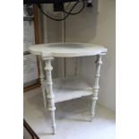 "HOWARD AND SONS OF BERNERS STREET, LONDON" A fancy shaped topped two tier table on well-turned
