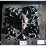 CARVED WOODEN PANEL DEPICTING THE GREEN MAN amongst scrolling foliage