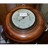 A MAHOGANY CASED WALL BAROMETER, the dial inscribed "H. Hinsley Burgham, Optician Ipswich", dial