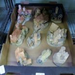 A BOX CONTAINING A SELECTION OF HAND-PAINTED CAST MODEL DWELLINGS the majority by David Winter