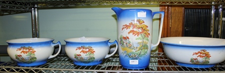 A FOUR PIECE TRANSFER DECORATED POTTERY TOILET SET comprising water jug & bowl and two chamber pots.