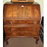 A REPRODUCTION MAHOGANY FINISHED BUREAU UNIT having single falldown writing slope revealing