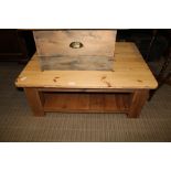 A LARGE MODERN PINE SCRUBBED TOPPED RECTANGULAR TABLE on substantial blocked legs with planked