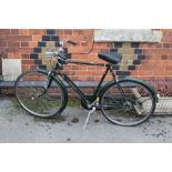 A VINTAGE DESIGN RALEIGH SUPERB BRITISH RACING GREEN FINISHED UPRIGHT BICYCLE, with Brooks padded