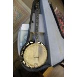 A VINTAGE CASED BANJO