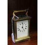 A WORKING BRASS CARRIAGE CLOCK
