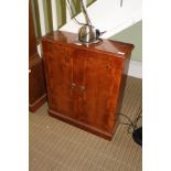 A REPRODUCTION YEW WOOD COLOURED CD STORAGE CABINET