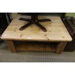 A LARGE MODERN PINE SCRUBBED TOPPED RECTANGULAR TABLE on substantial blocked legs with planked