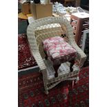 A WHITE FINISHED WOVEN WICKER WORK CONSERVATORY ARMCHAIR TOGETHER WITH A RECTANGULAR FOOTSTOOL