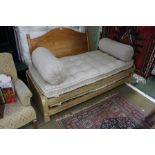 A PAIR OF LIMED OAK FRAMED LOAF BRANDED DAY BED SLEEPERS