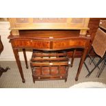 A REPRODUCTION MAHOGANY FINISHED SEPENTINE FRONTED SIDE TABLE having cross banded top over two flush