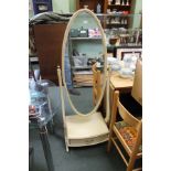 AN OVAL PLAIN PLATE DRESSING CHEVAL MIRROR WITH A BOX BASE, FITTED WITH A SINGLE DRAWER