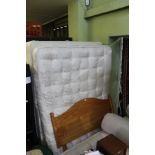 A DOUBLE DIVAN BED BASE MATTRESS AND PINE HEADBOARD