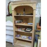 A WASHED PINE FINISHED SET OF DEEP OPEN ADJUSTABLE SHELVES