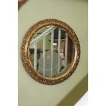 A PIERCED GILT FRAMED CIRCULAR BEVELLED PLATE WALL MIRROR