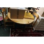 A MODERN PINE KITCHENETTE SUITE comprising circular topped table with green painted four legged base