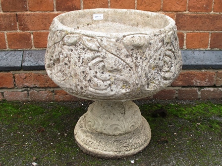 A CAST CONCRETE PEDESTAL PLANTER