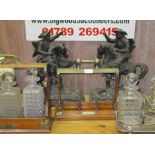 AN ELKINGTON & CO SILVER PLATE THREE BOTTLE TANTALUS STAND together with two oak & metal mounted