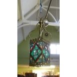 A 20TH CENTURY BRASS EFFECT FRAMED MULTI-COLOURED LEADED PANEL HANGING LANTERN