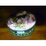 A TIN CONTAINING A SELECTION OF PORCELAIN MODEL ANIMALS the majority Wade Whimsies