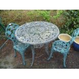 A GREEN PAINTED THREE PIECE GARDEN SUITE comprising table and two chairs