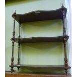 A REPRODUCTION MAHOGANY COLOURED SET OF HANGING SHELVES