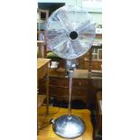 A CHROME FINISHED FLOOR STANDING ELECTRIC FAN