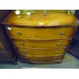 A WELL MADE REPRODUCTION MAHOGANY COLOURED BOW FRONT 4 DRAWER CHEST on plain bracket feet