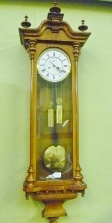 AN EARLY 20TH CENTURY WOOD AND GLASS VIENNESE HANGING WALL CLOCK with display weights and pendulum