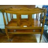 A REPRODUCTION YEW WOOD FINISHED CANTERBURY of typical design