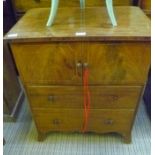 A GEORGIAN MAHOGANY COMMODE having two cupboard doors over two full width drawers