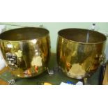 TWO BRASS LOG BINS each with lion mask ring handles and paw feet