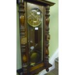 A WOOD AND GLASS VIENNESE STYLE HANGING WALL CLOCK