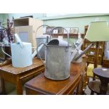 FOUR VARIOUS COLLECTOR'S WATERING CANS