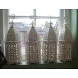 FOUR PAINTED AND PIERCED SHEET METAL LANTERNS
