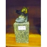 A CAST MODEL PANDA BEARING PARIS FOUNDRY MARK SAT UPON A MARBLE PLINTH