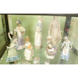 A SELECTION OF SPANISH PORCELAIN FEMALE FIGURINES the majority clothed