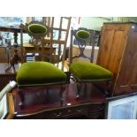 A PAIR OF EDWARDIAN BEDROOM/SALON CHAIRS with fancy carved frames, green valour upholstered back and