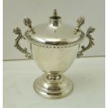 A SILVER PEDESTAL CIGARETTE OIL LAMP LIGHTER of urn form with twin flame finials, central