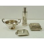 FOUR SILVER ITEMS includes a plain vesta, small twin handled trophy form salt, an embossed pill